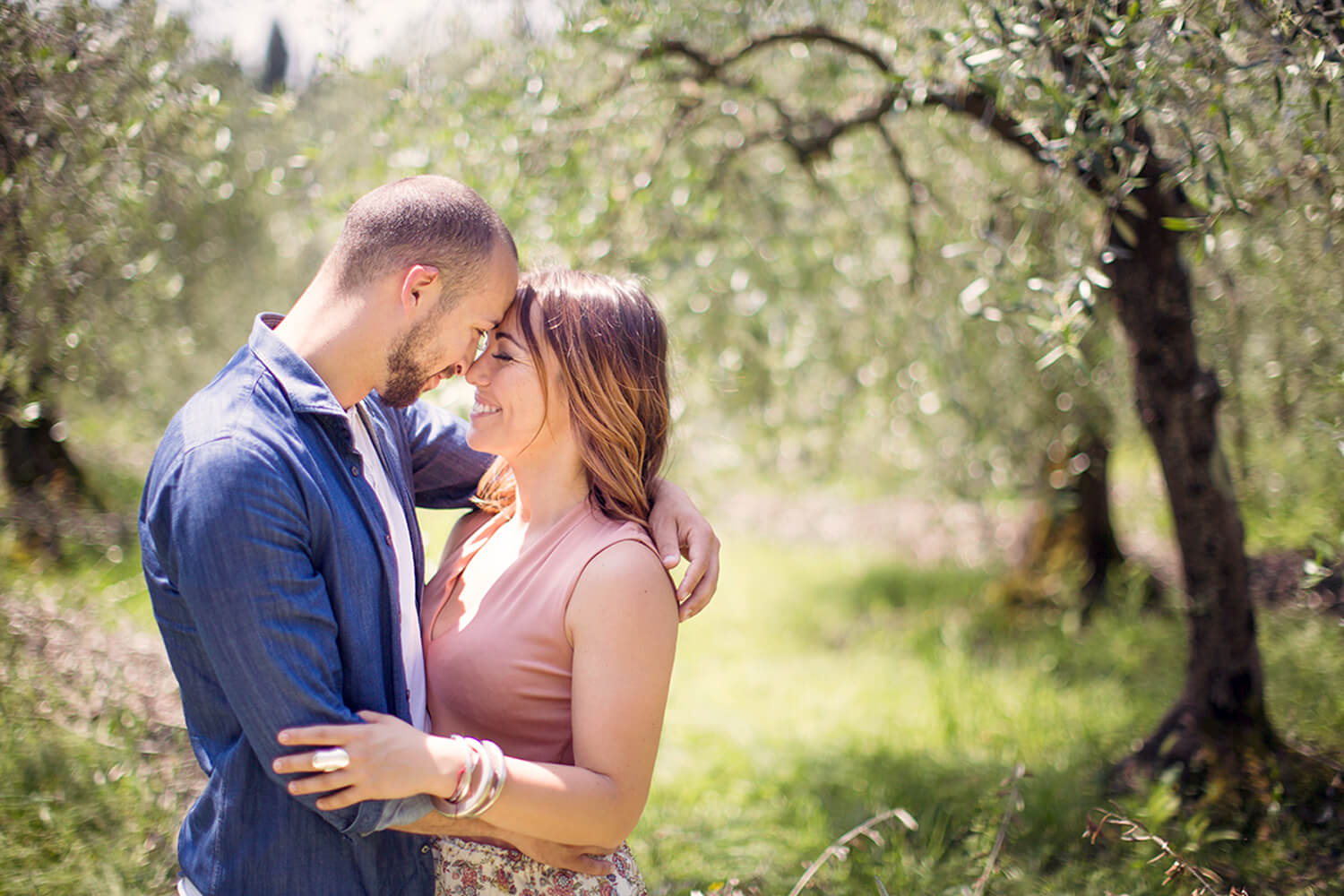 Couple hugging near olive trees