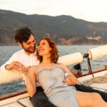 Couple on a boat in Cinque Terre during a sunset private tour
