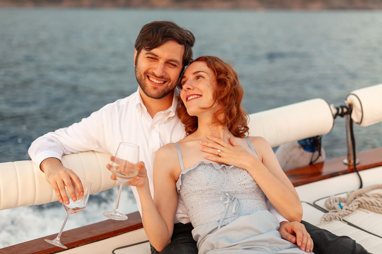 Couple drinking Prosecco on a boat in Cinque Terre