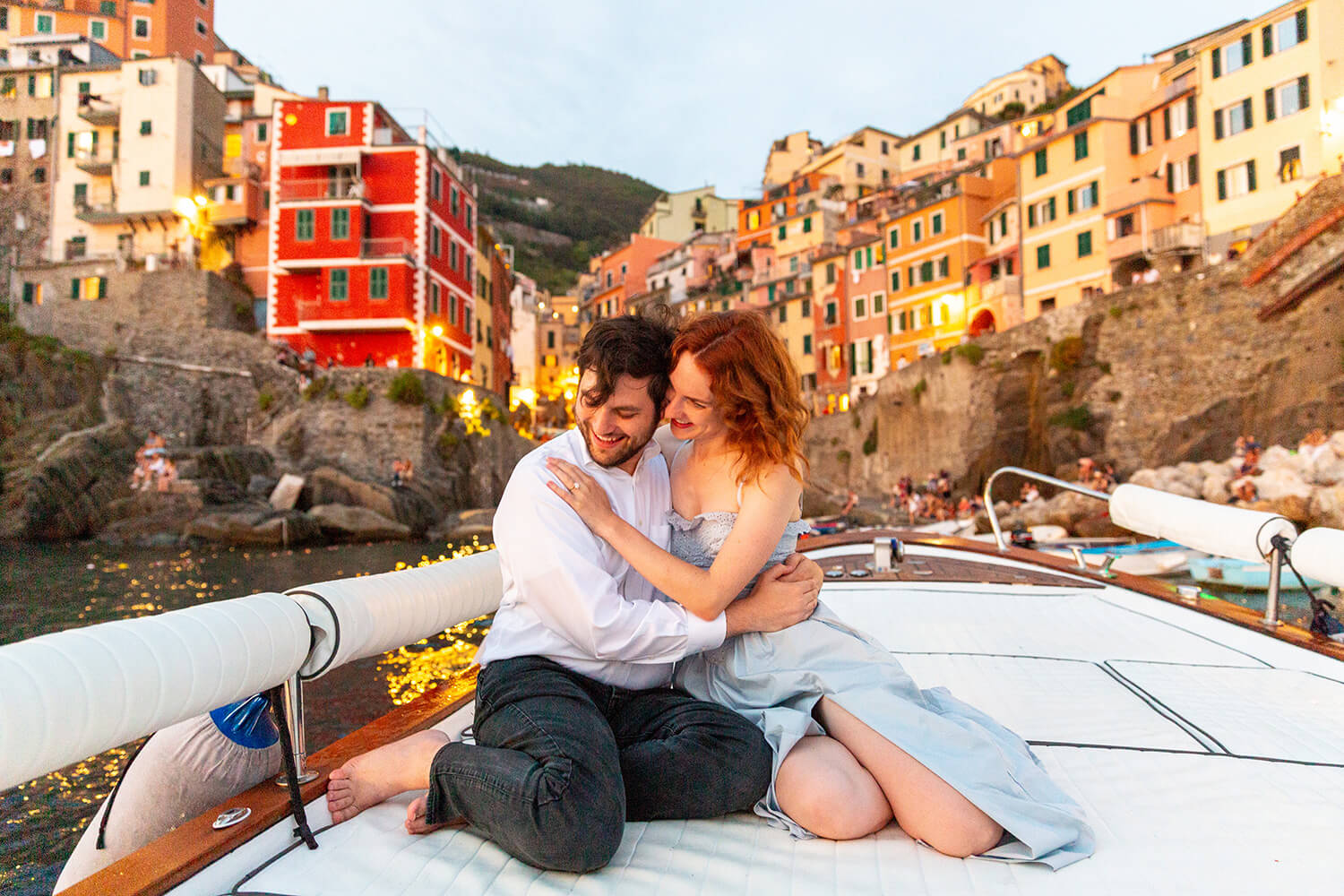Couple on a boat in Riomaggiore at sunset